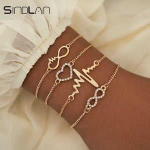 Sindlan 4PCs Crystal Heart Infinity Bracelets for Women Gold Heart Beat Charm Wrist Chain Bracelets Set Fashion Hand Jewelry